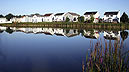 [house reflections in pond]
